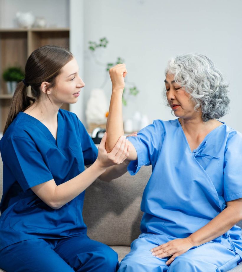 senior-woman-doing-exercise-at-clinic-with-physiot-2024-08-21-01-16-26-utc (1)